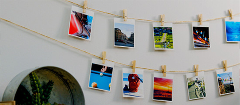 QX10_Glassesv2 Canon Selphy Square Printer_Image of prints hanging on the wall
